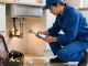 This page highlights an experienced plumber addressing urgent plumbing issues in a modern kitchen.