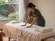 Discover the soothing 서울출장마사지 experience in a calming home setting with a professional therapist preparing a serene environment.